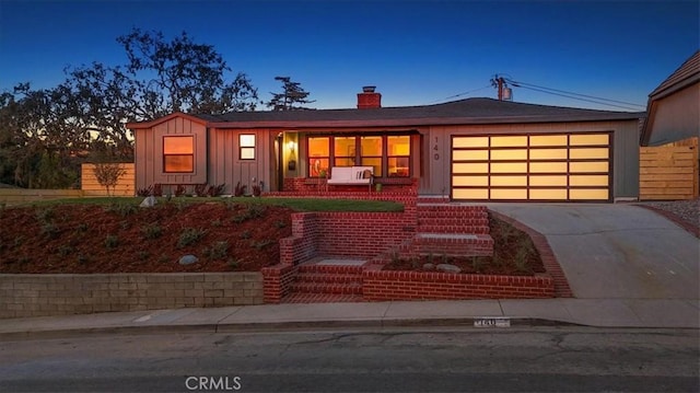 ranch-style home featuring a garage