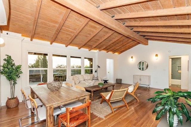 dining area with hardwood / wood-style floors, vaulted ceiling with beams, and wood ceiling