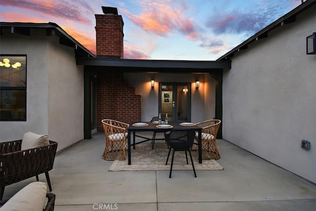 view of patio terrace at dusk