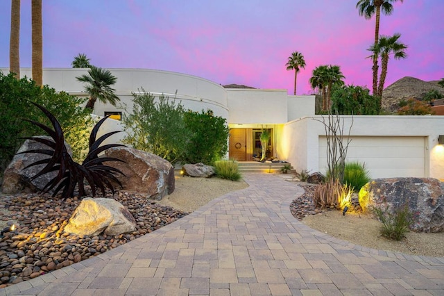 art deco home with a garage