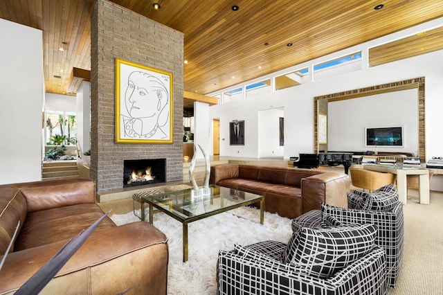 living room with a high ceiling, a brick fireplace, and wooden ceiling