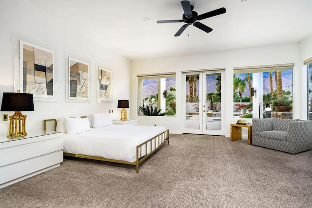 carpeted bedroom featuring ceiling fan and access to outside