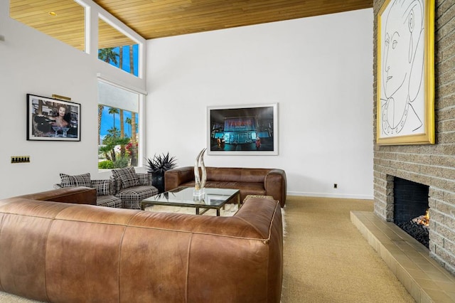 living room featuring light carpet, wooden ceiling, and a fireplace