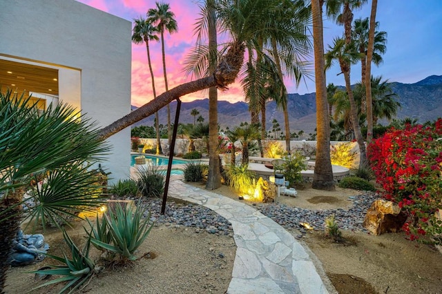 yard at dusk with a mountain view