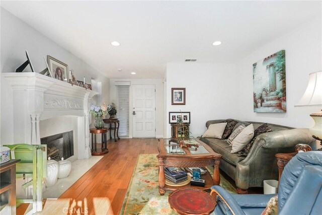 living room with light hardwood / wood-style flooring