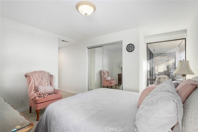 carpeted bedroom featuring a closet