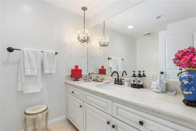 bathroom with tile patterned floors and vanity