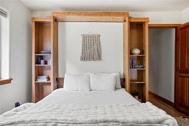 bedroom featuring dark hardwood / wood-style flooring