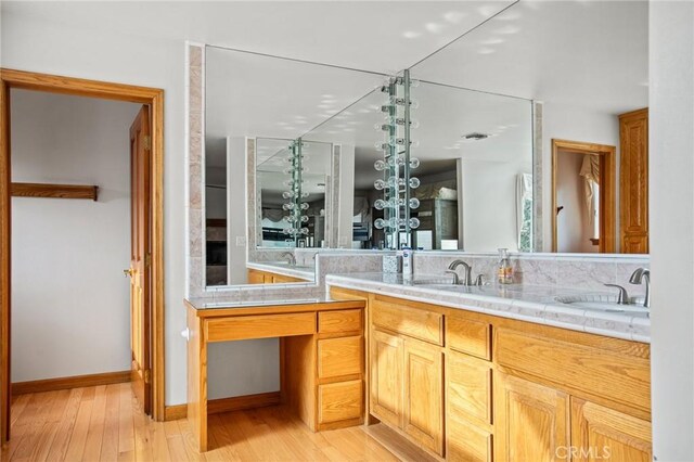 bathroom featuring vanity and hardwood / wood-style flooring