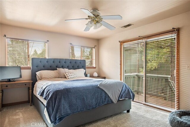 bedroom featuring ceiling fan, light carpet, and access to outside