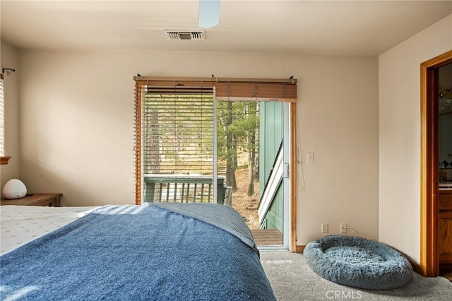 bedroom with carpet floors and access to outside