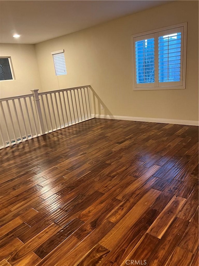 unfurnished room featuring dark hardwood / wood-style flooring