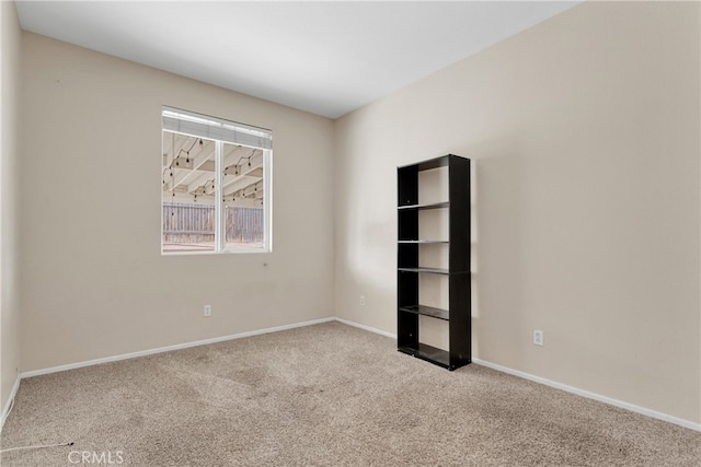 unfurnished room with carpet flooring