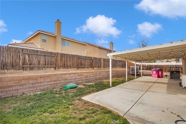 view of yard featuring a patio area and cooling unit