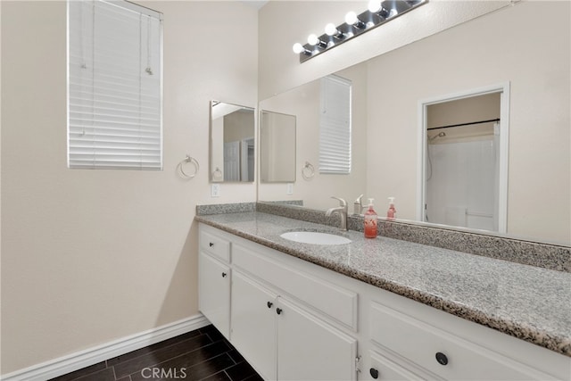 bathroom with vanity and wood-type flooring