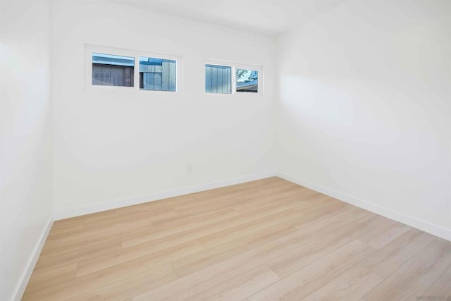 spare room featuring light hardwood / wood-style floors