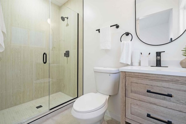 bathroom featuring vanity, toilet, and walk in shower