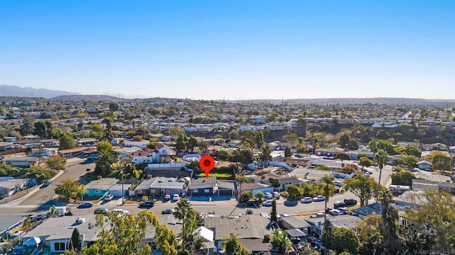 birds eye view of property featuring a mountain view