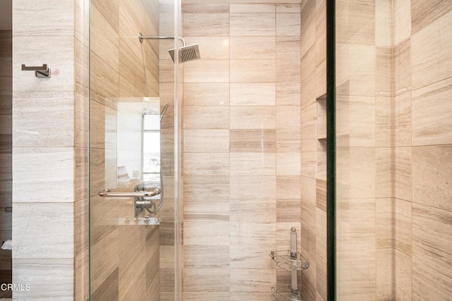 bathroom featuring an enclosed shower