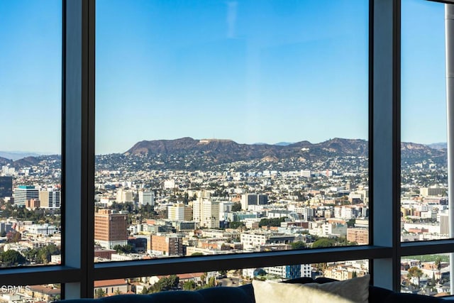 property's view of city featuring a mountain view