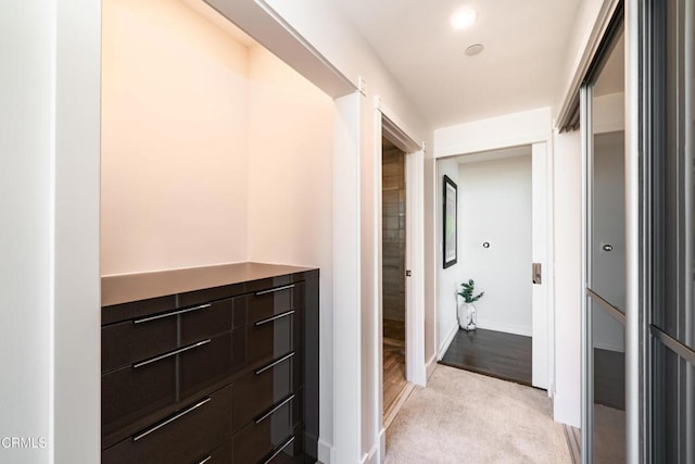 corridor with light colored carpet