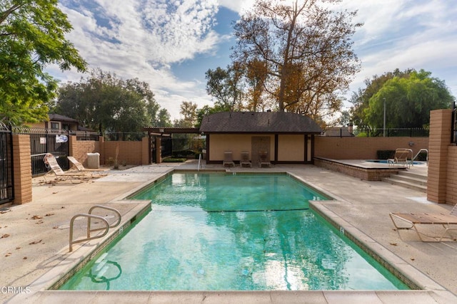 view of swimming pool with a patio area