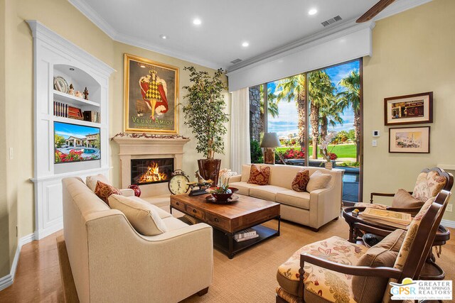 living room featuring crown molding