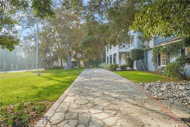 view of home's community featuring a yard