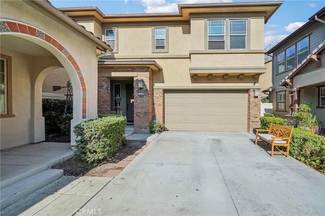 townhome / multi-family property featuring a garage