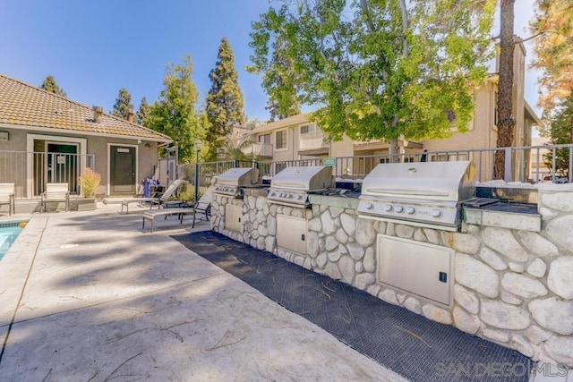 view of patio / terrace featuring an outdoor kitchen and grilling area