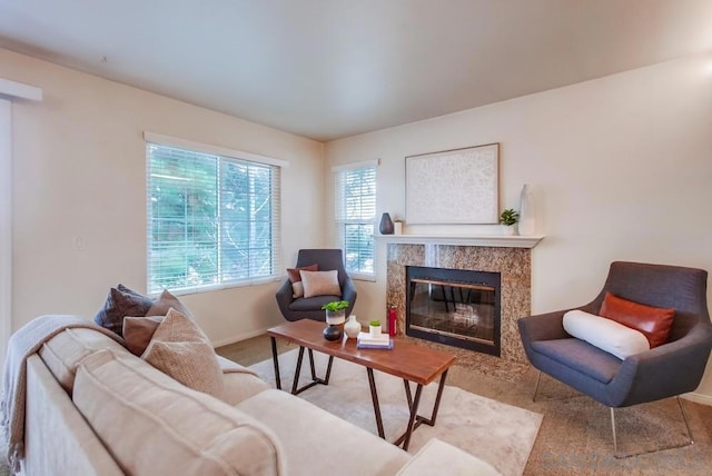 living room with light carpet and a premium fireplace