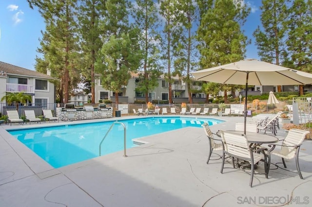 view of swimming pool with a patio area