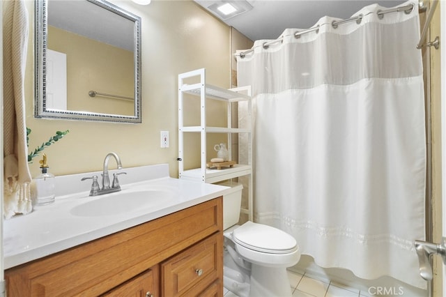 bathroom featuring tile patterned flooring, vanity, toilet, and walk in shower