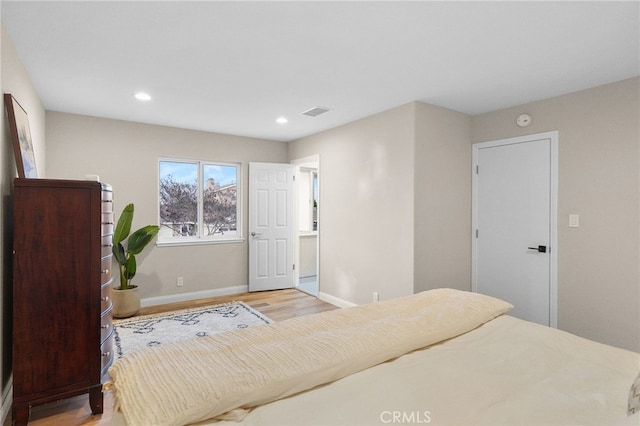 bedroom featuring light hardwood / wood-style floors