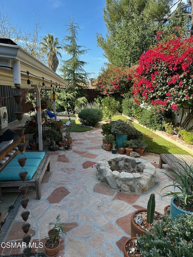 view of patio with an outdoor fire pit