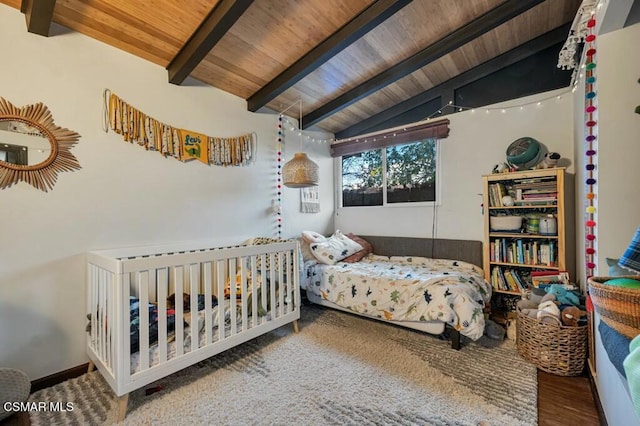 bedroom featuring wood ceiling, vaulted ceiling with beams, and wood-type flooring