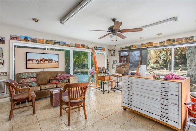 interior space with ceiling fan