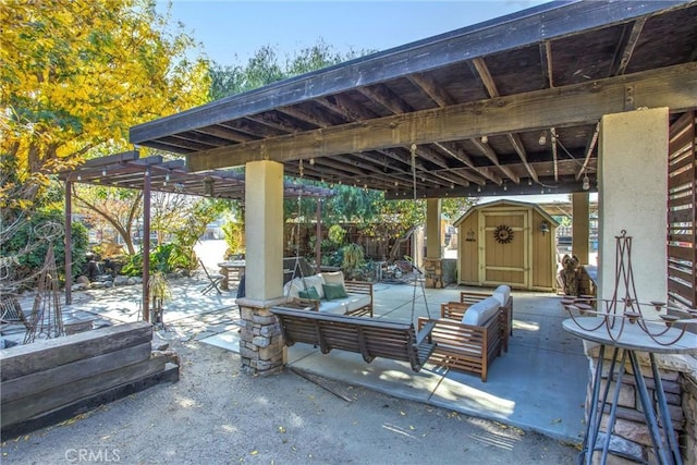 view of patio / terrace featuring outdoor lounge area and a storage unit