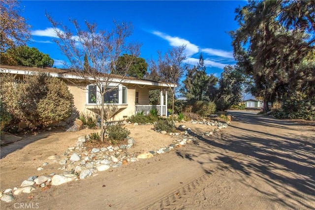 view of front of home featuring covered porch