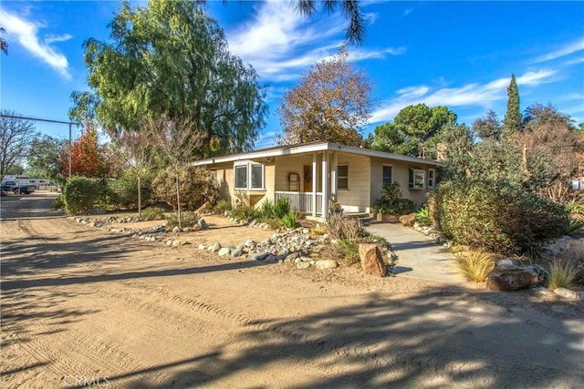 view of front of property featuring covered porch