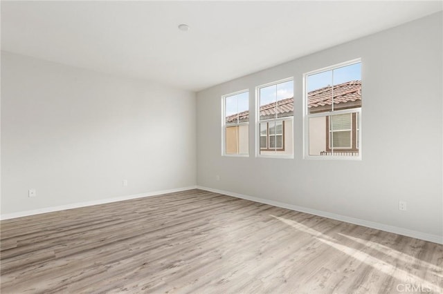 unfurnished room featuring light wood-type flooring