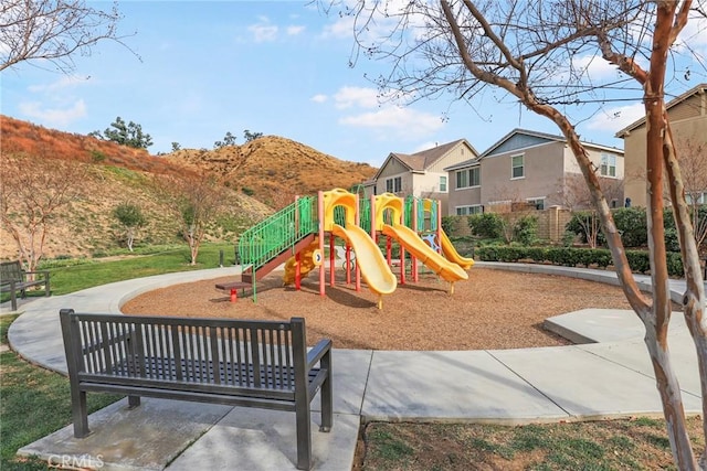 view of playground with a mountain view