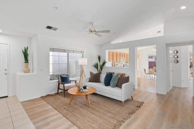 living room featuring light wood-type flooring, ceiling fan, and lofted ceiling