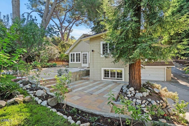 exterior space featuring a patio area and a garage