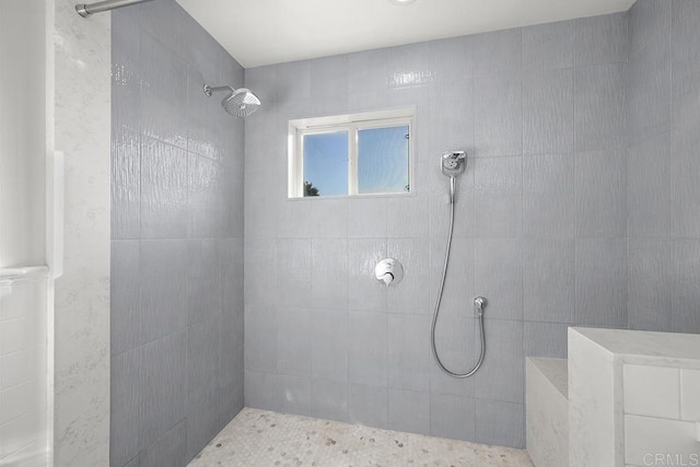 bathroom with a tile shower