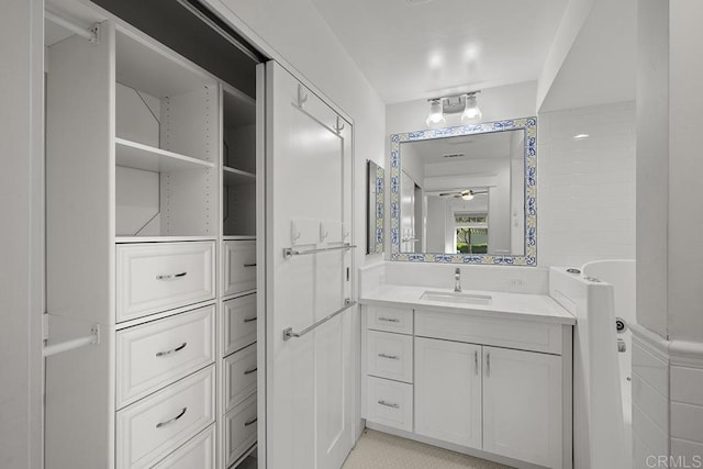 bathroom featuring vanity and ceiling fan