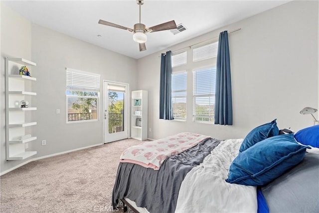 carpeted bedroom with access to outside, multiple windows, and ceiling fan