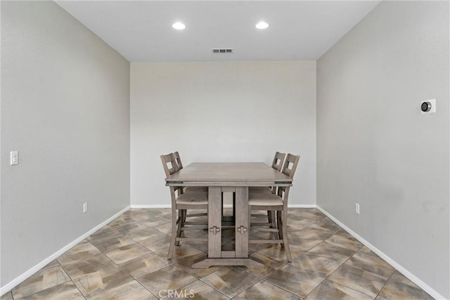 dining room with recessed lighting and baseboards