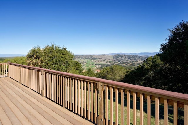 wooden terrace with a mountain view