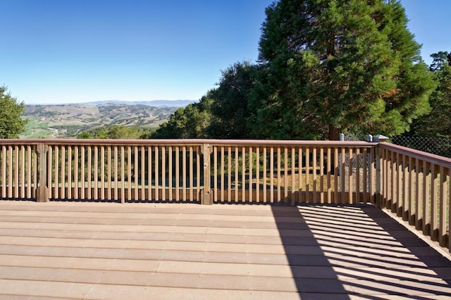 wooden terrace with a mountain view